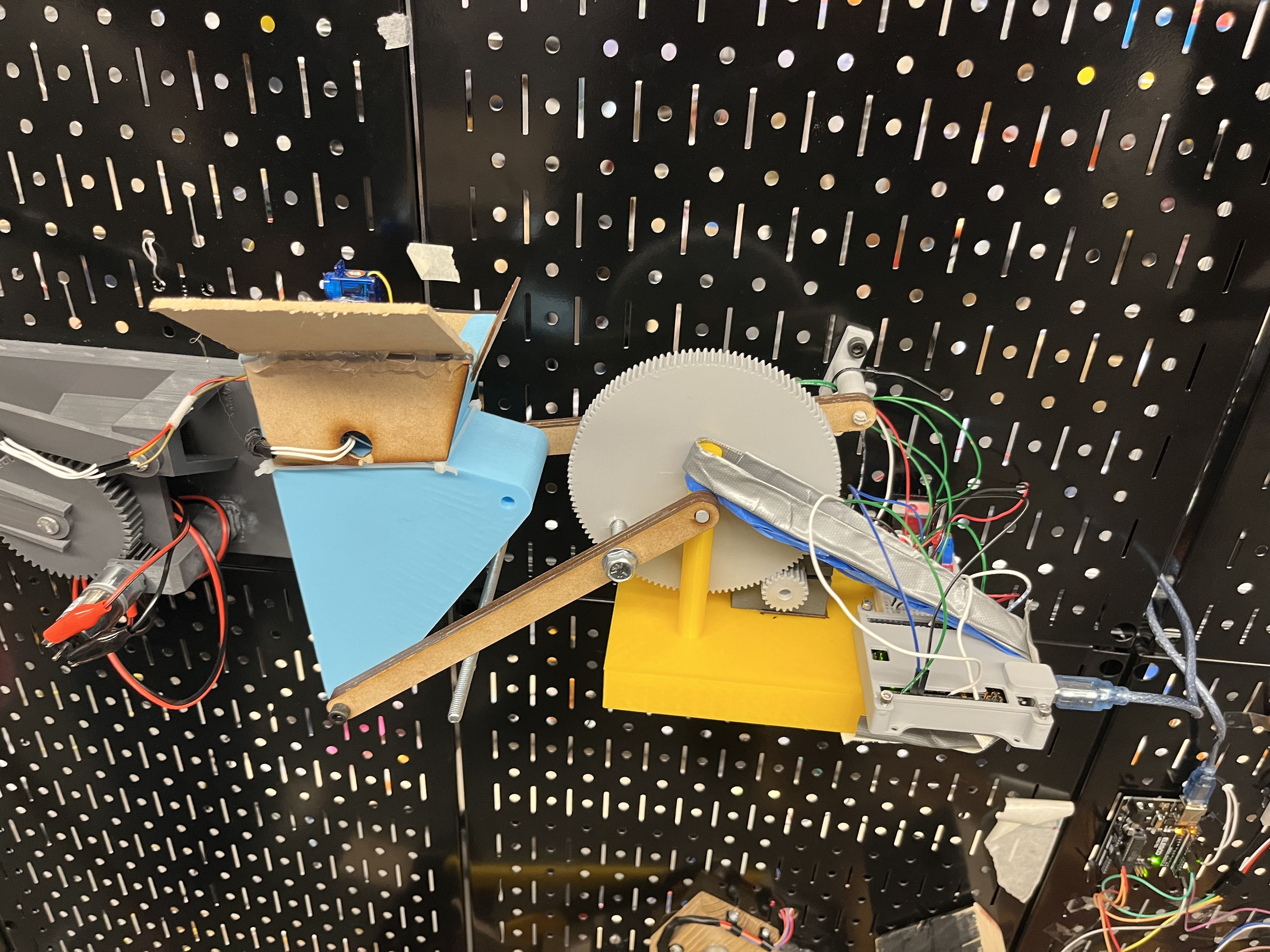Photo of final Mechanism mounted to pegboard